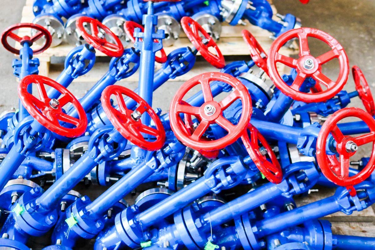 Many new small iron metal shut-off valves, regulating valves with flanges for installation on pipelines, units, vessels at an oil refinery, petrochemical, chemical industrial plant, enterprise