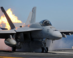 A Super Hornet taking off from the USS Abraham Lincoln Flight Deck