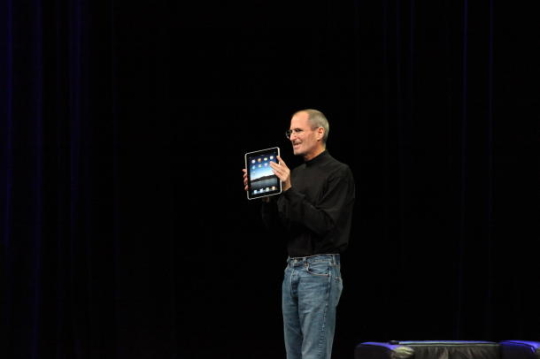 Steve Jobs with Apple's iPad tablet