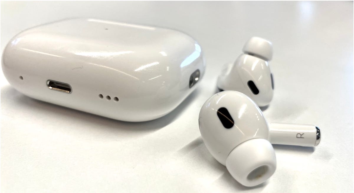 AirPods Pro 2 on white surface.
