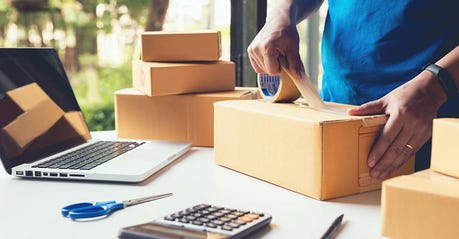 Man worker delivery service and working packing box, business owner working checking order to confirm before sending customer in post , Shipment Online Sales