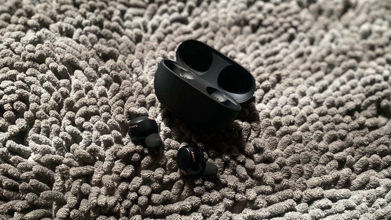 Sony WF-1000XM5 in black against a grey background