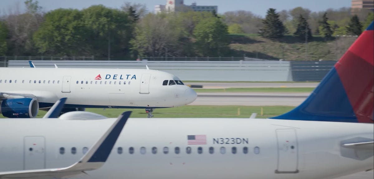 Delta Airlines planes on a runway.