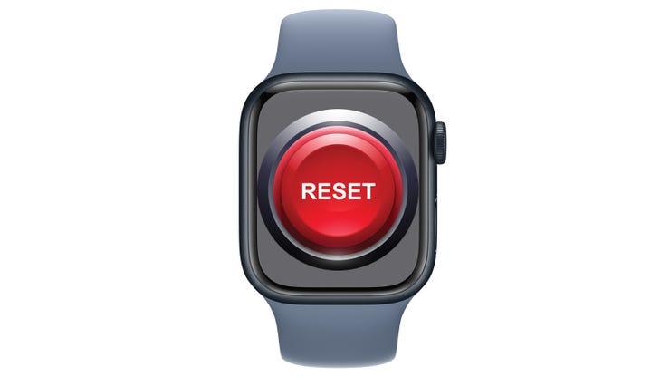 Apple Watch dengan tombol Reset terhampar di atasnya