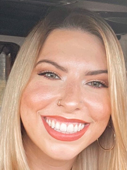 Alexandria Tapia, a blonde woman, smiles at the camera