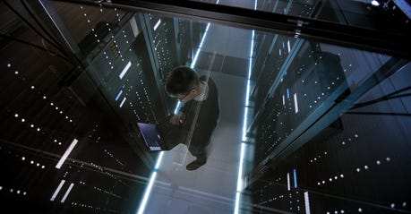 it-engineer-working-with-laptop-in-data-center.jpg