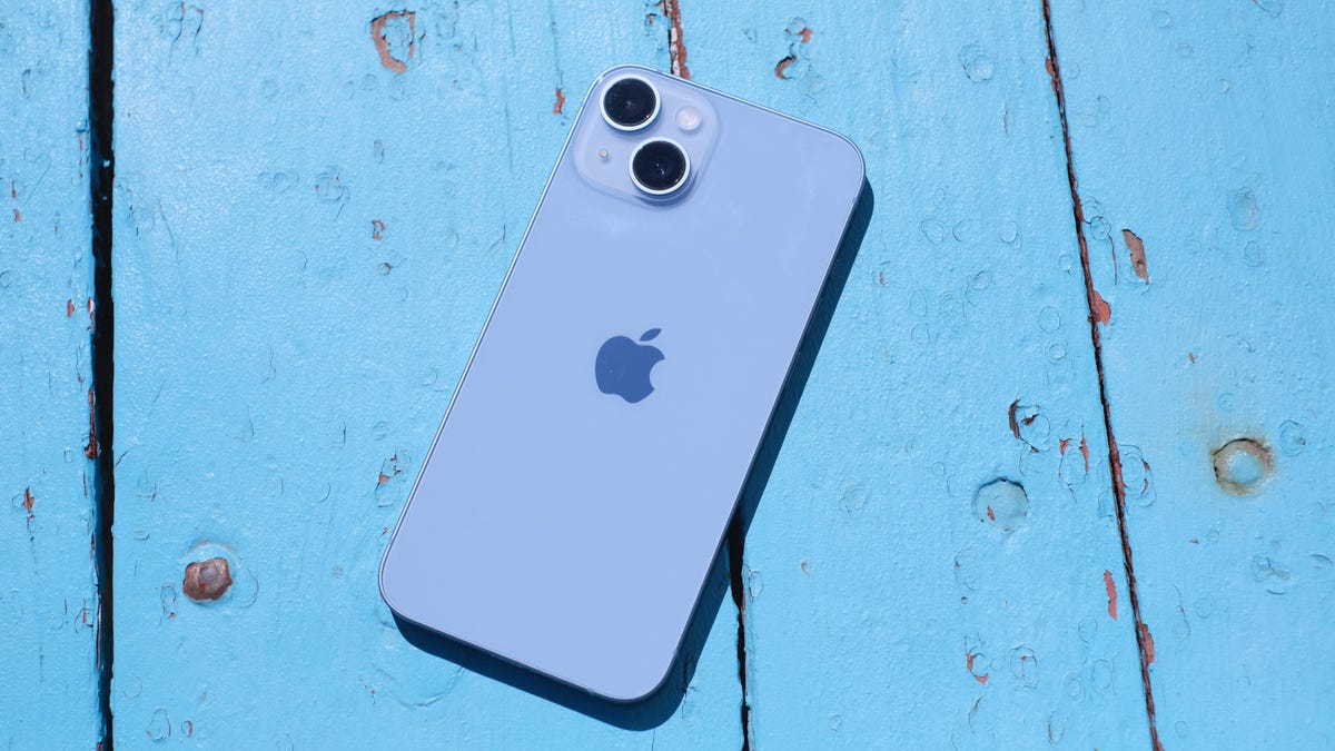 iPhone 14 on a blue background