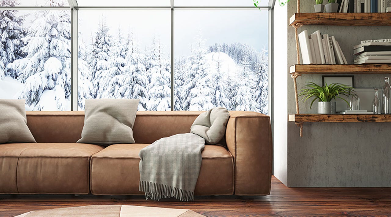 Living room with window showing snowy trees