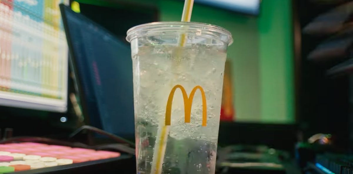 McDonald's cup filled with clear liquid.