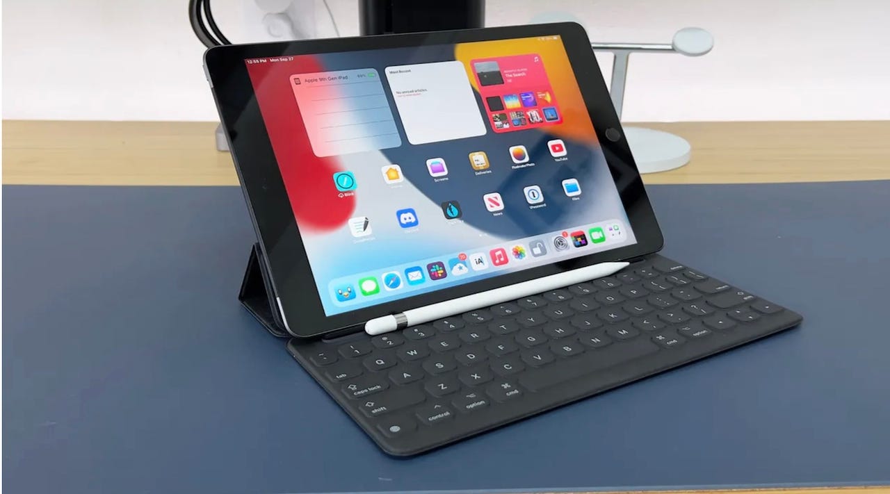 The 9th generation iPad with an attached keyboard on a desk setting