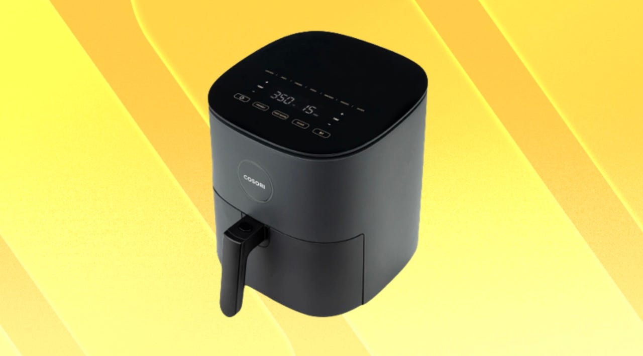 Cosori air fryer on yellow background