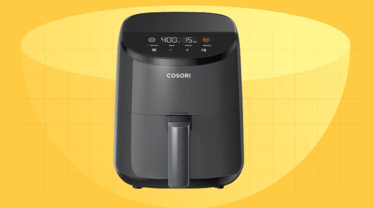 Cosori air fryer oven on yellow background