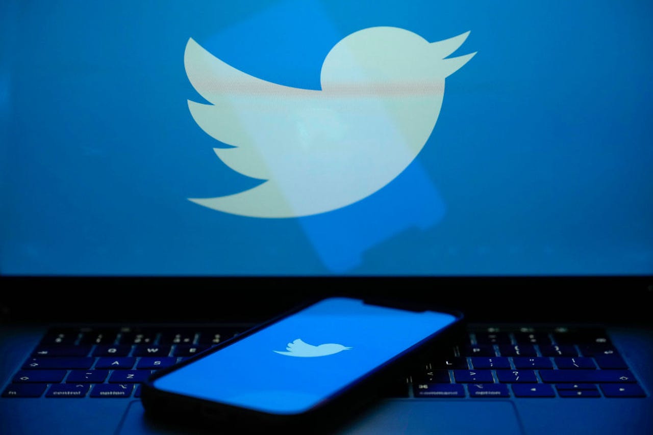 Twitter logo on laptop and phone