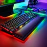 A Razer Huntsman Elite on a desk with other Razer gaming accessories