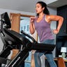 Close-up of a young woman using the Bowflex Treadmill 10 as part of her workout