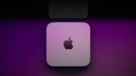 Mac Mini on desk with purple glowing background