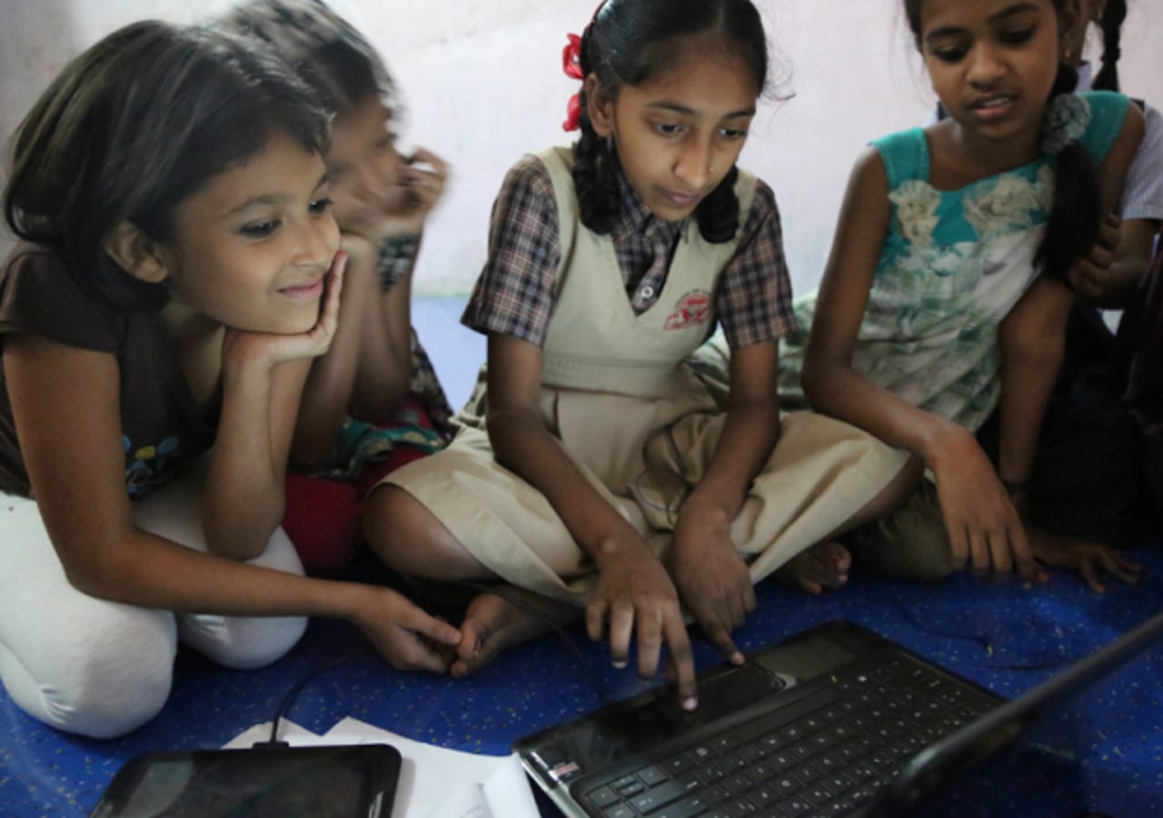 The Tech Girls of Mumbai in front of a computer