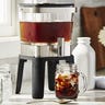 Cold brew coffee maker stand on kitchen counter glasses full of ice