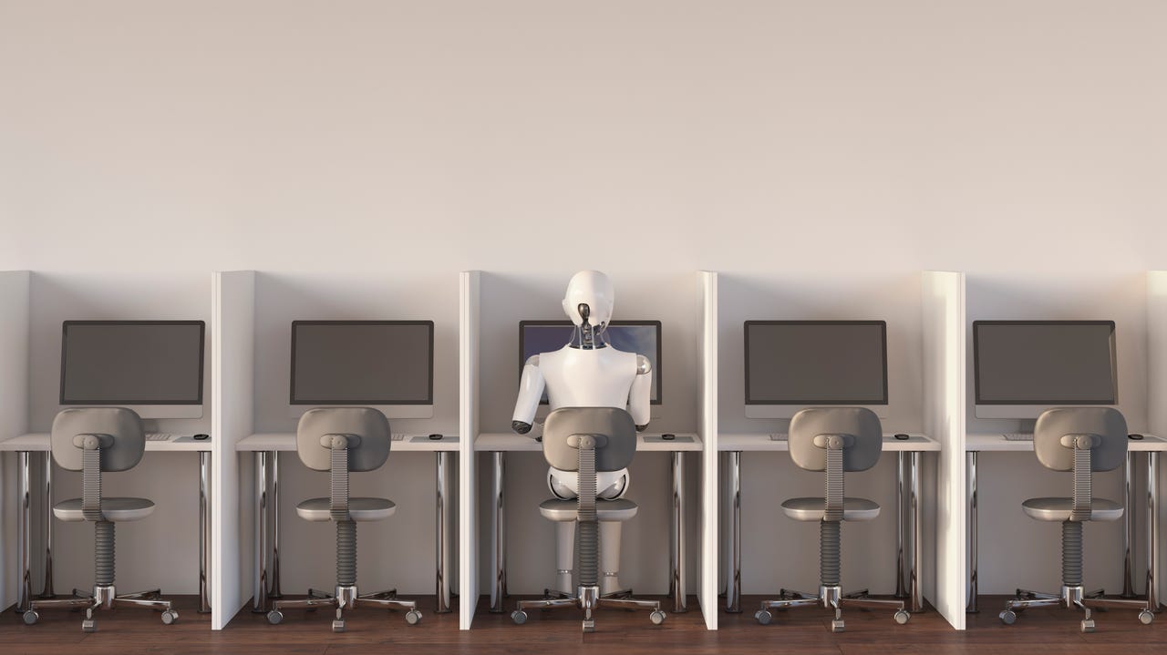 A photo of empty cubicles with a robot sitting in the middle