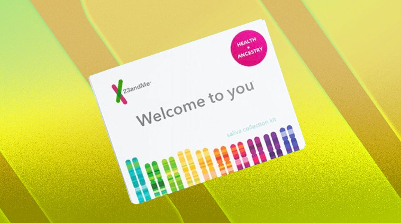 23andMe DNA test kit against a yellow striped background