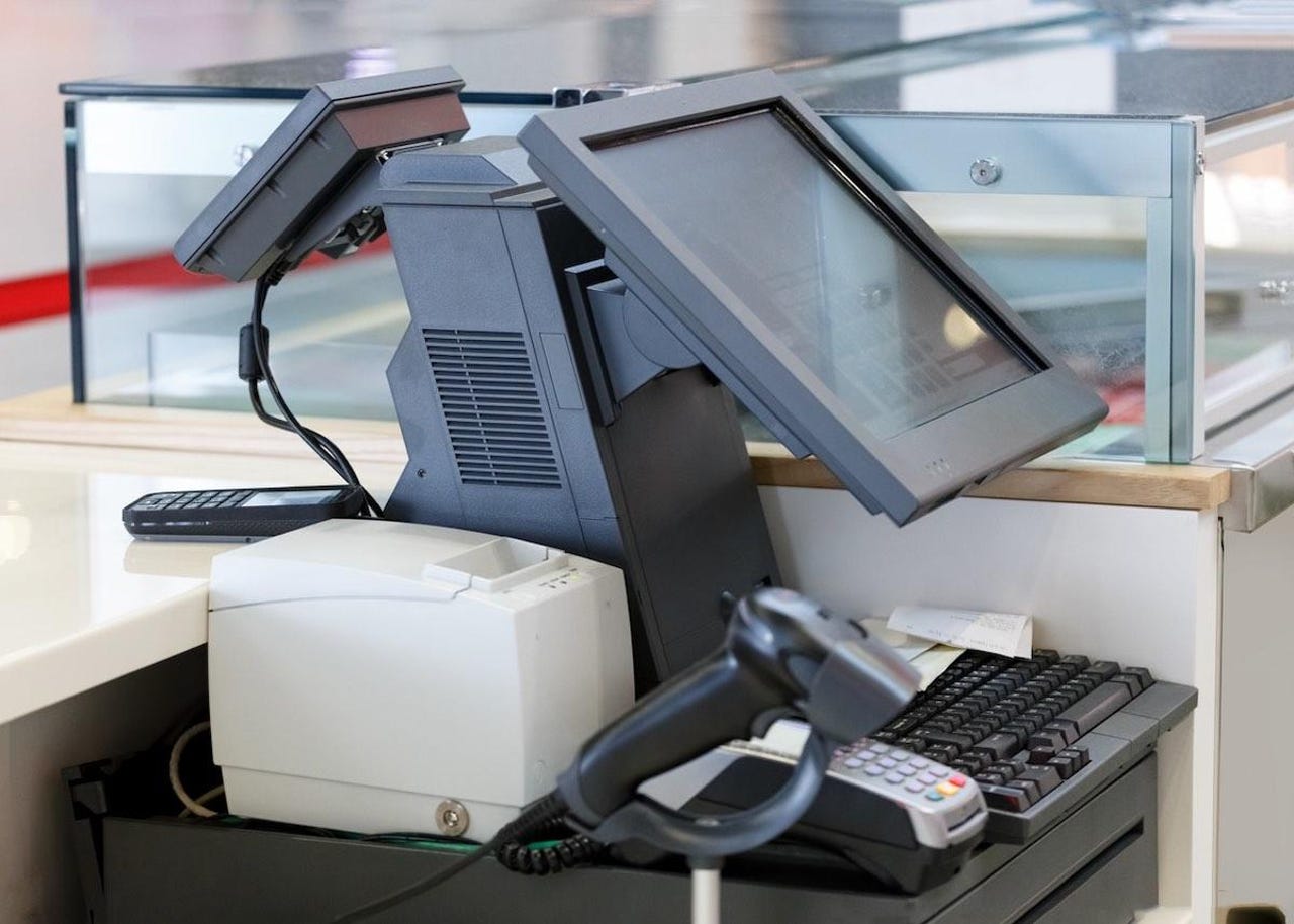 Cash desk with computer screen and Credit Card Machine with Barcode Scanner