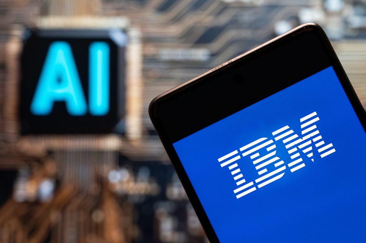 IBM logo on phone with AI in background