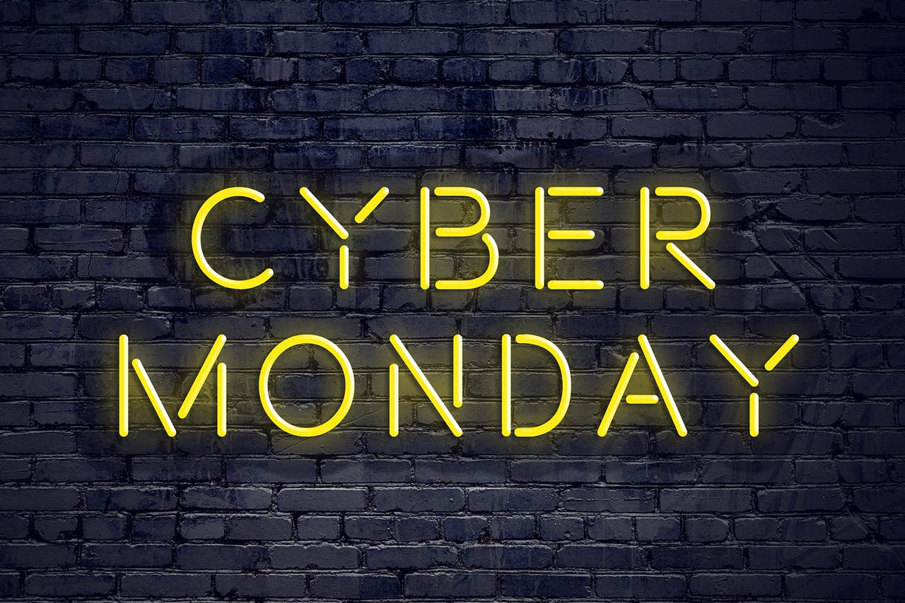 Night view of neon sign with text cyber monday