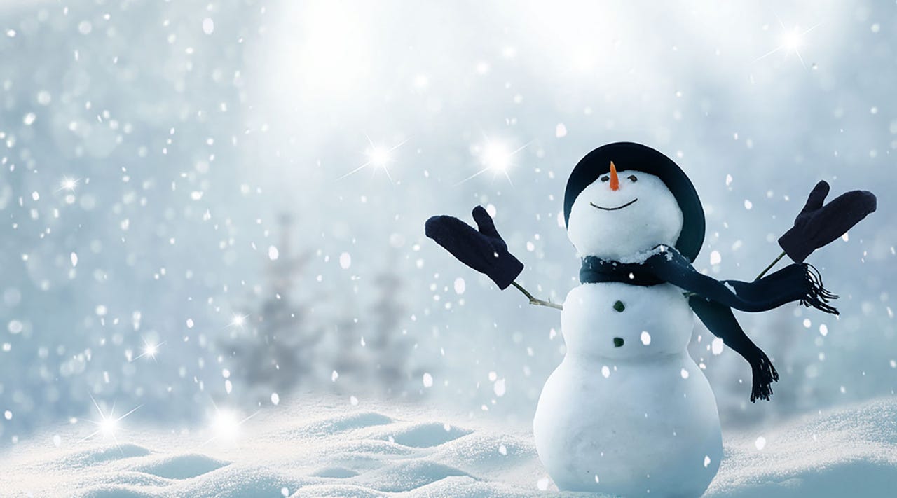 Snowman with arms outstretched in the snow