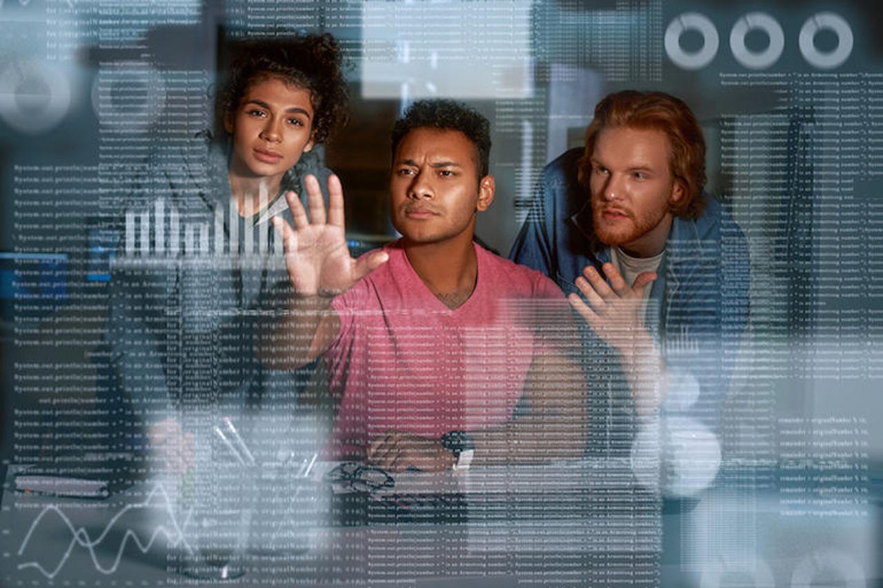 Young team of data analysts are looking over the data