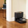 Roomba j7+ docked in its charging station in the corner of a home