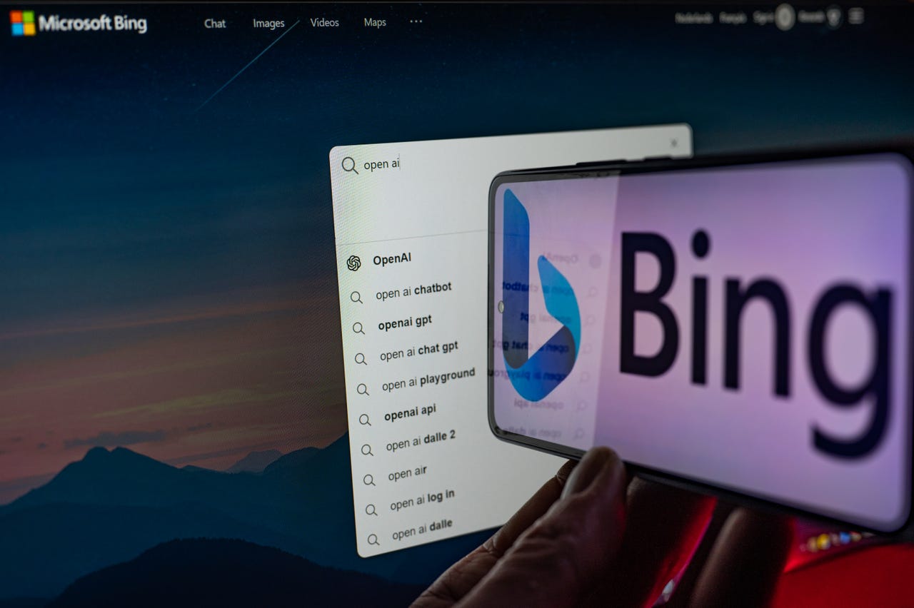 Bing homepage with a phone that has Bing's logo right in front of it
