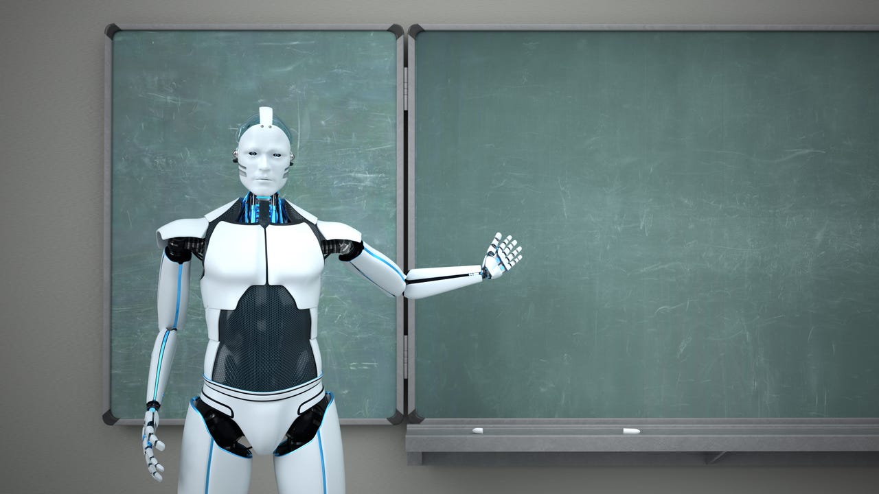 Robot standing in front of a chalkboard