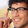 Close-up of a young man using a pair of Echo Frames