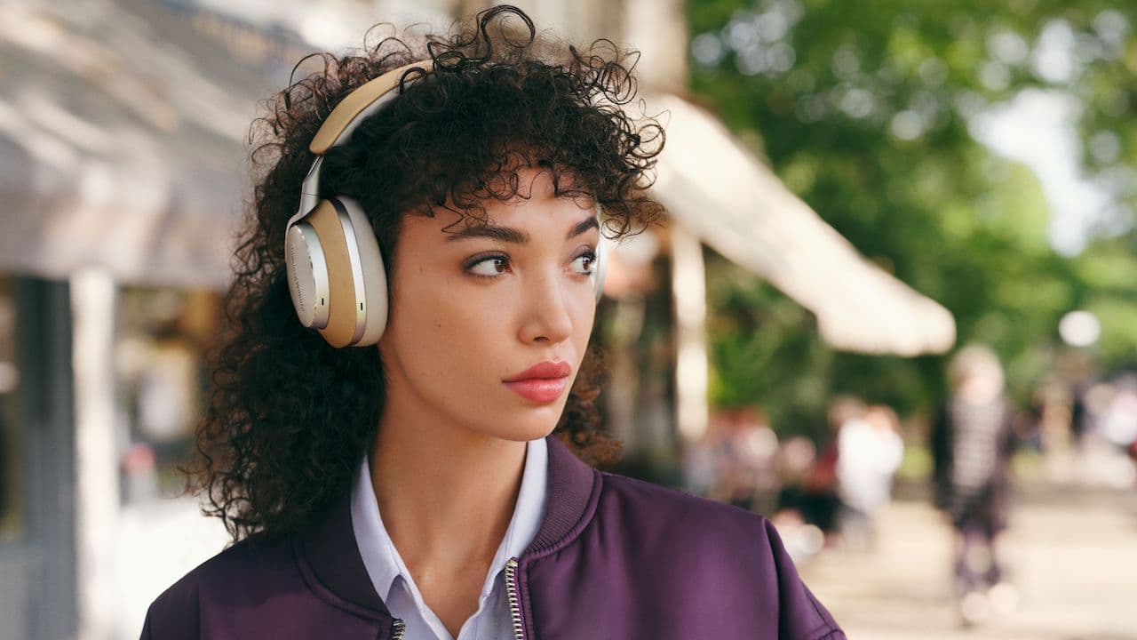 Woman wearing wireless Bowers & Wilkins headphones outdoors