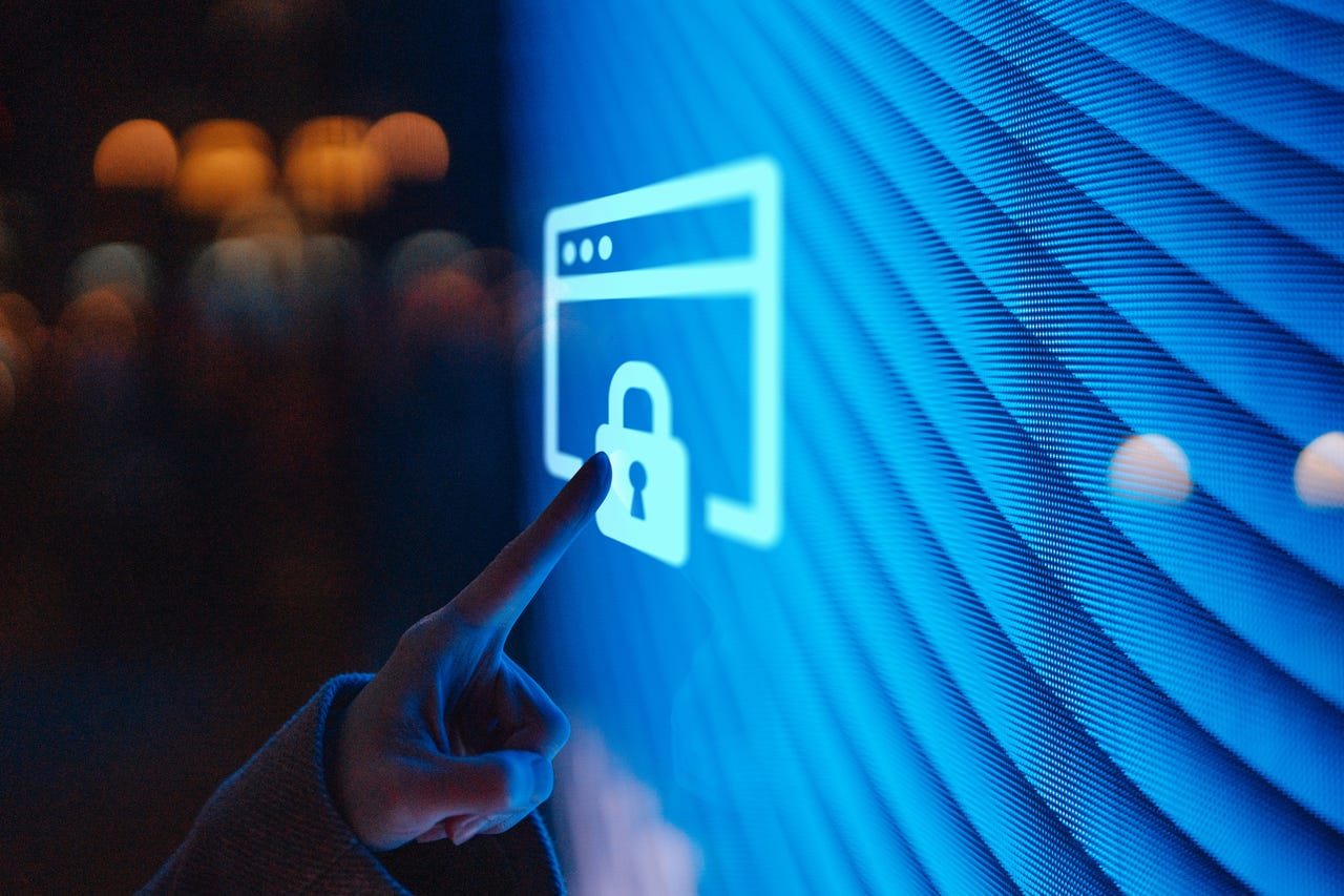 Hand pointing to lock on a screen