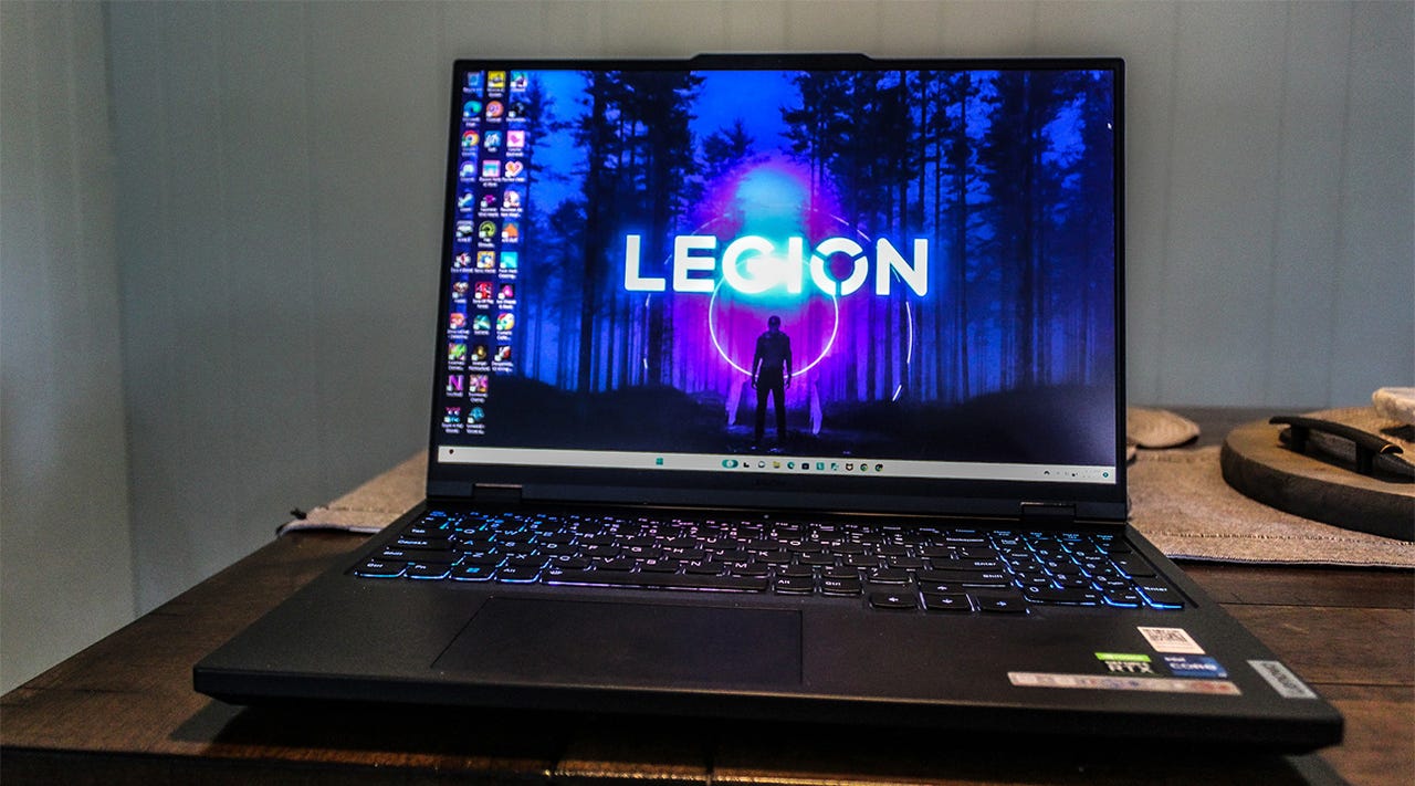 A Lenovo Legion Pro 5i laptop on a dinging table