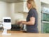 Smart Security Camera In Kitchen As Woman Prepares Meal