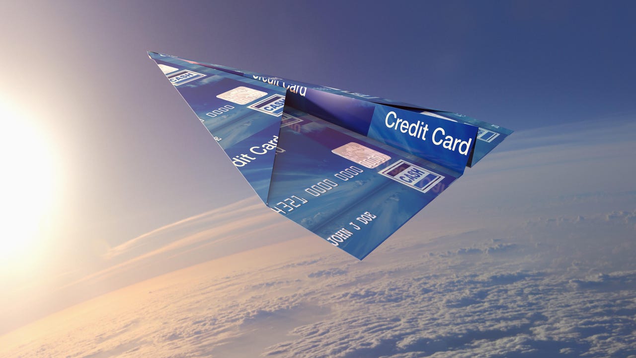 credit card paper plane in sky