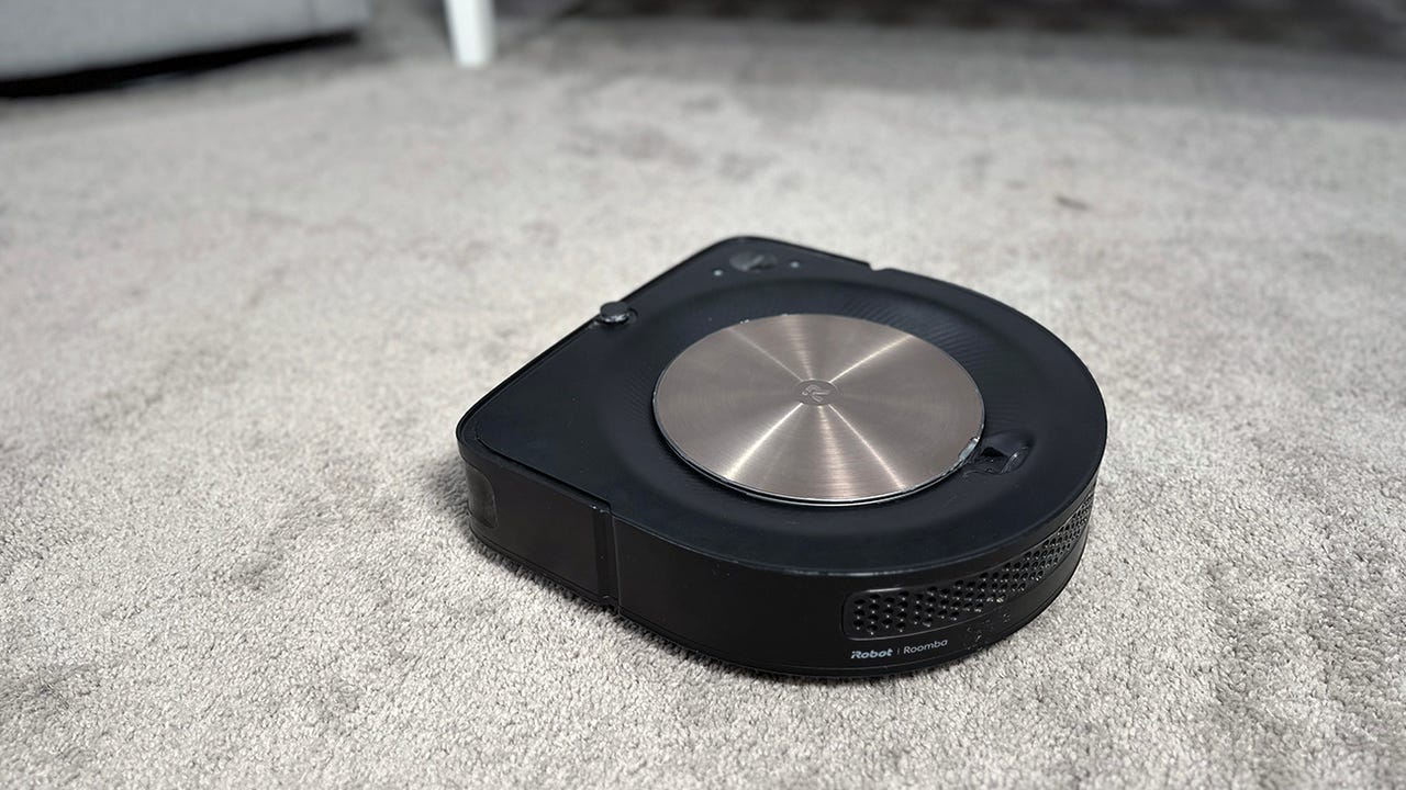 Roomba s9+ vacuuming on carpet.
