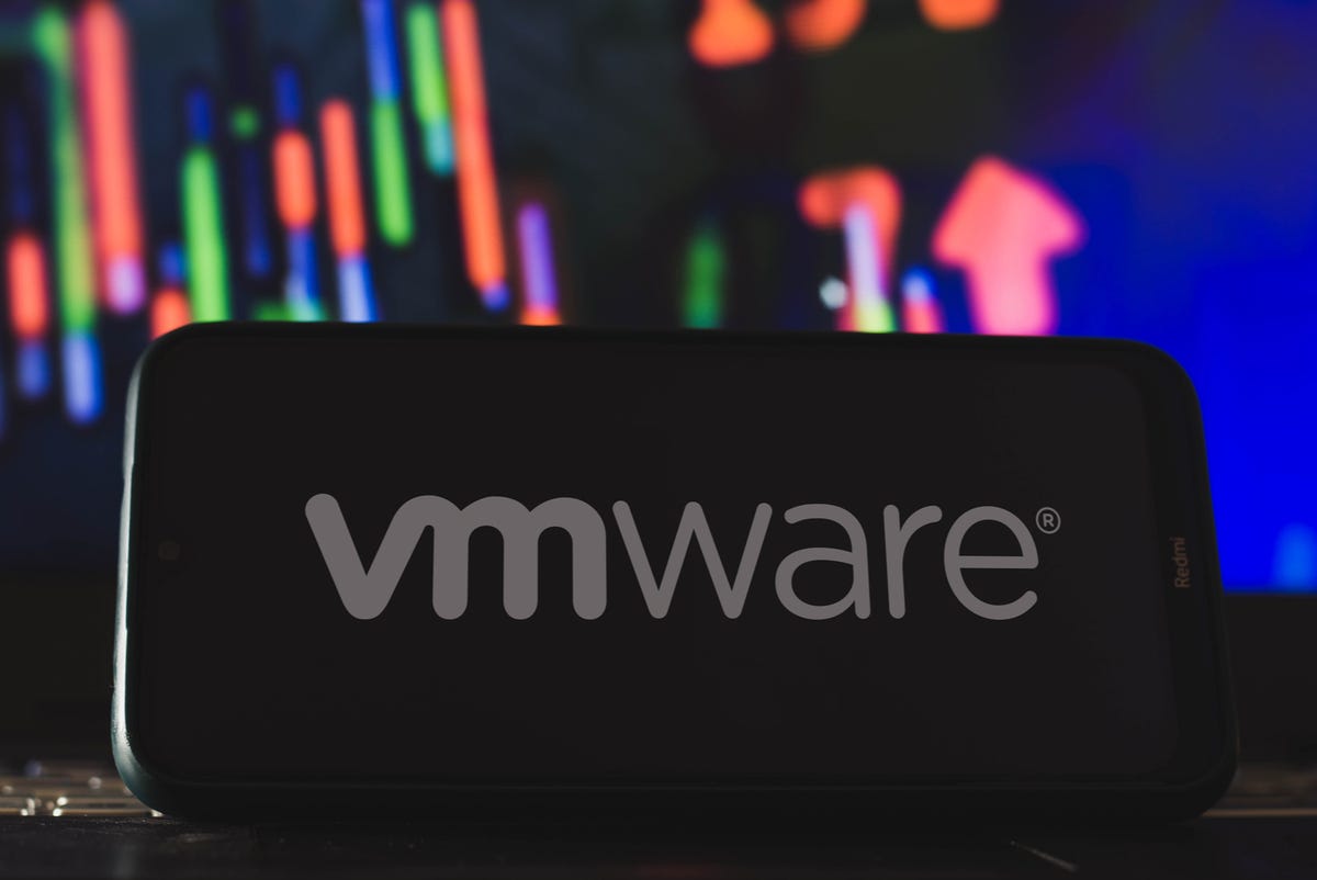 VMware logo on a phone in front of a dynamic background