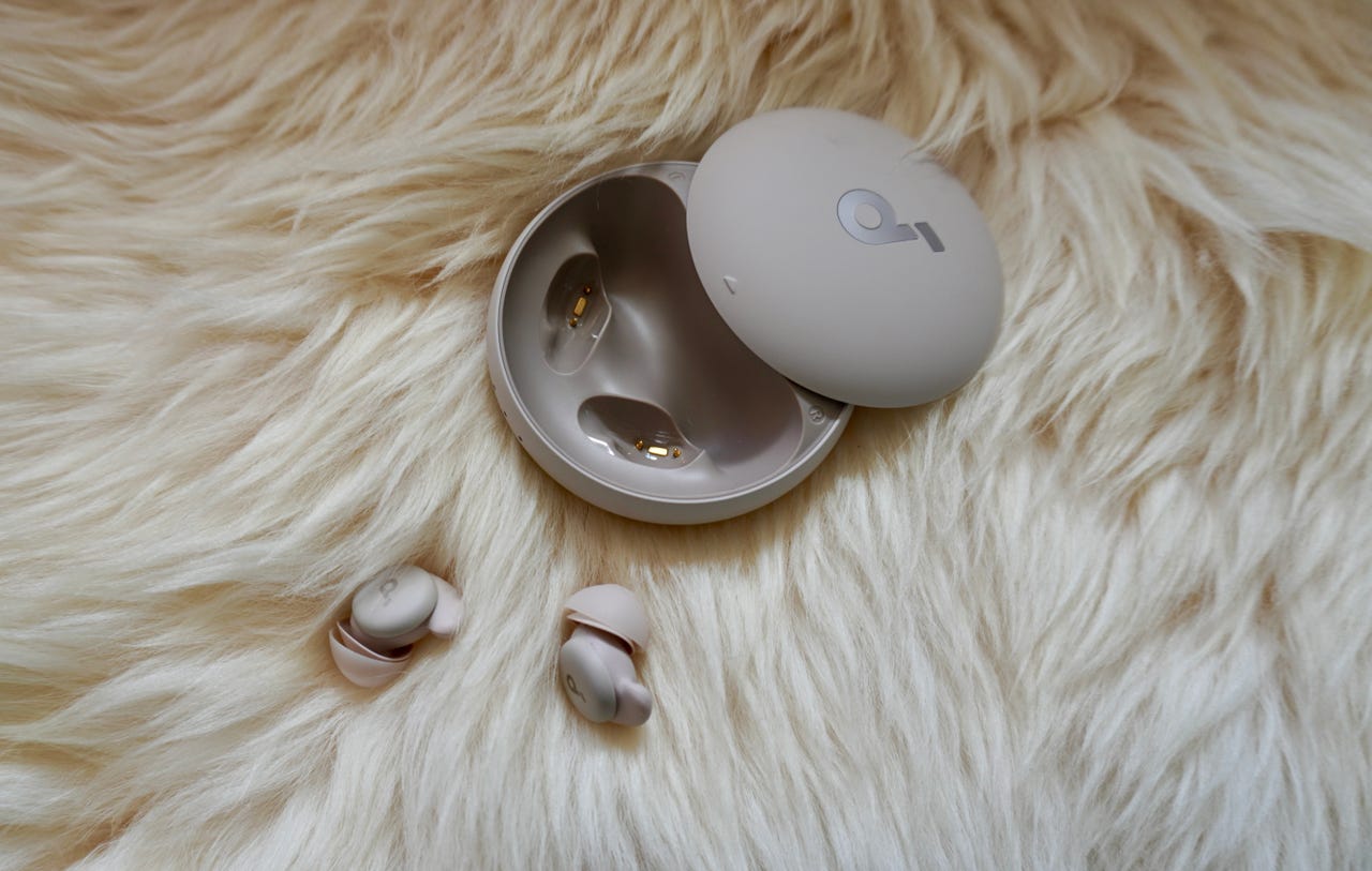 Soundcore sleep earbuds A20 against rug