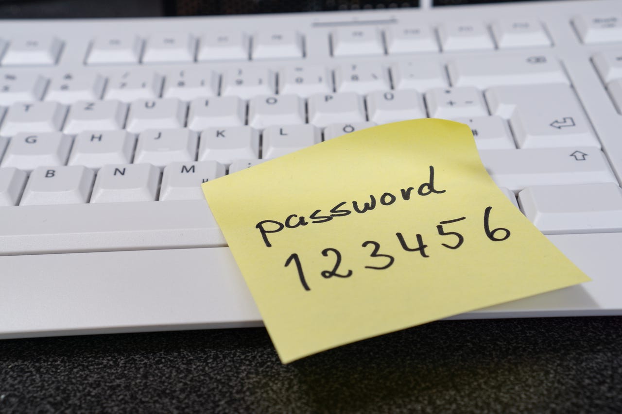 Password on a post it note stick to keyboard