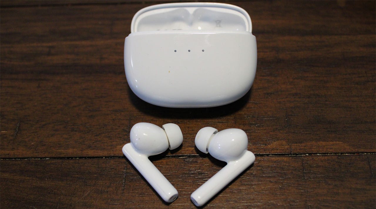 Close-up of the Ugreen HiTune T3 earbuds and their charging case