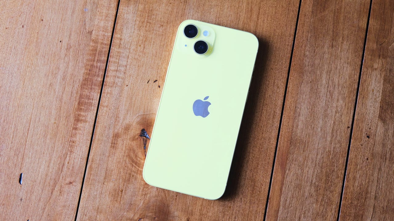 The yellow iPhone 14 Plus on a tabletop.