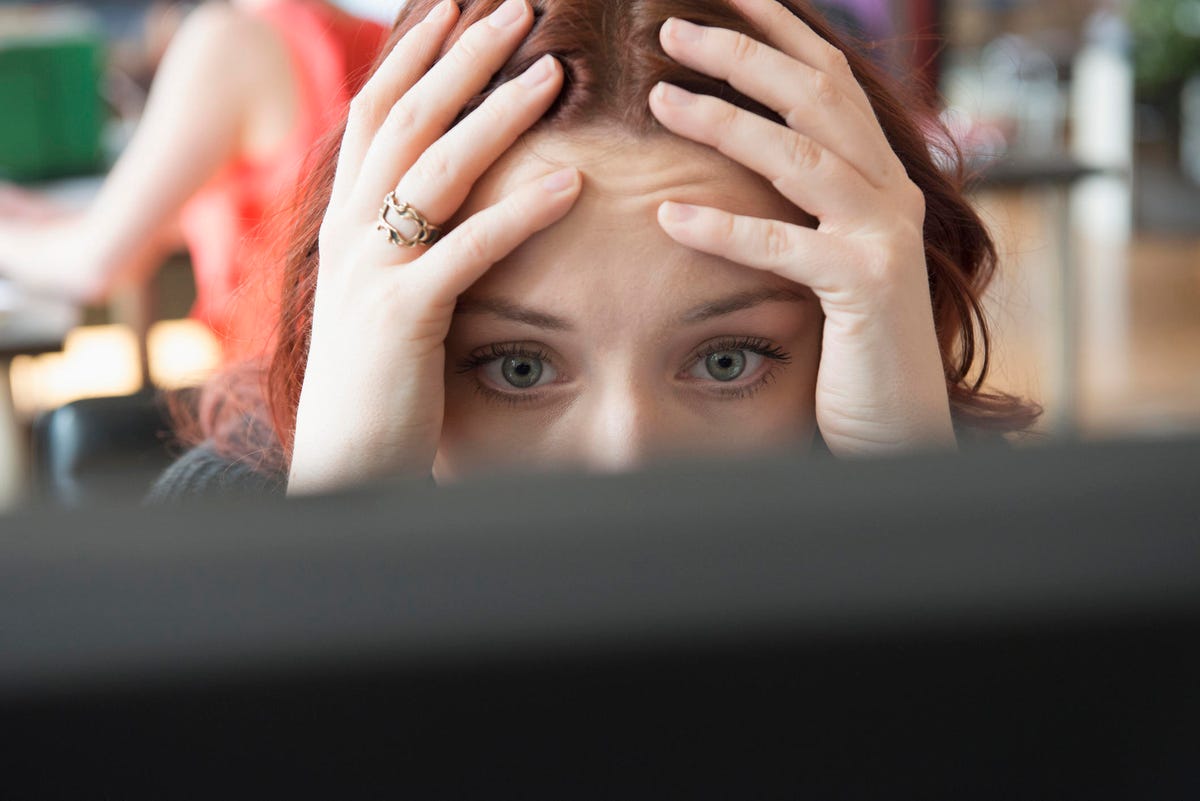 frustrated-woman-at-a-computer-in-an-office.jpg