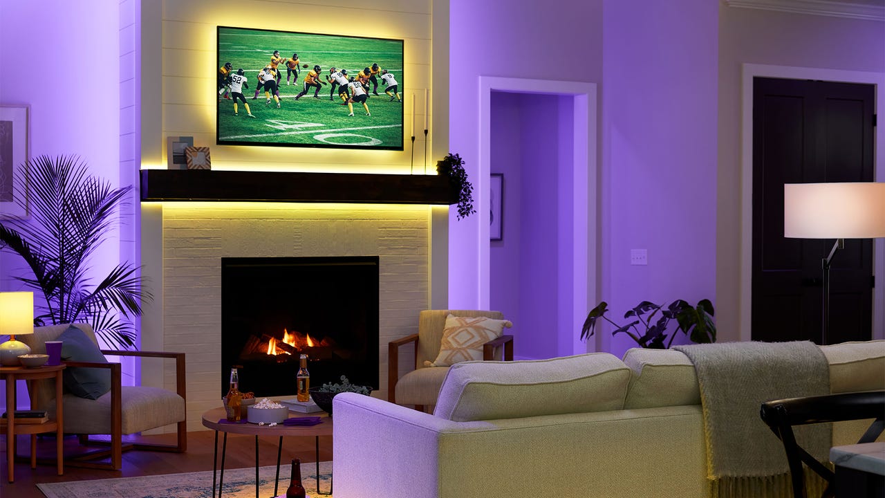 Sports on flat screen over fireplace