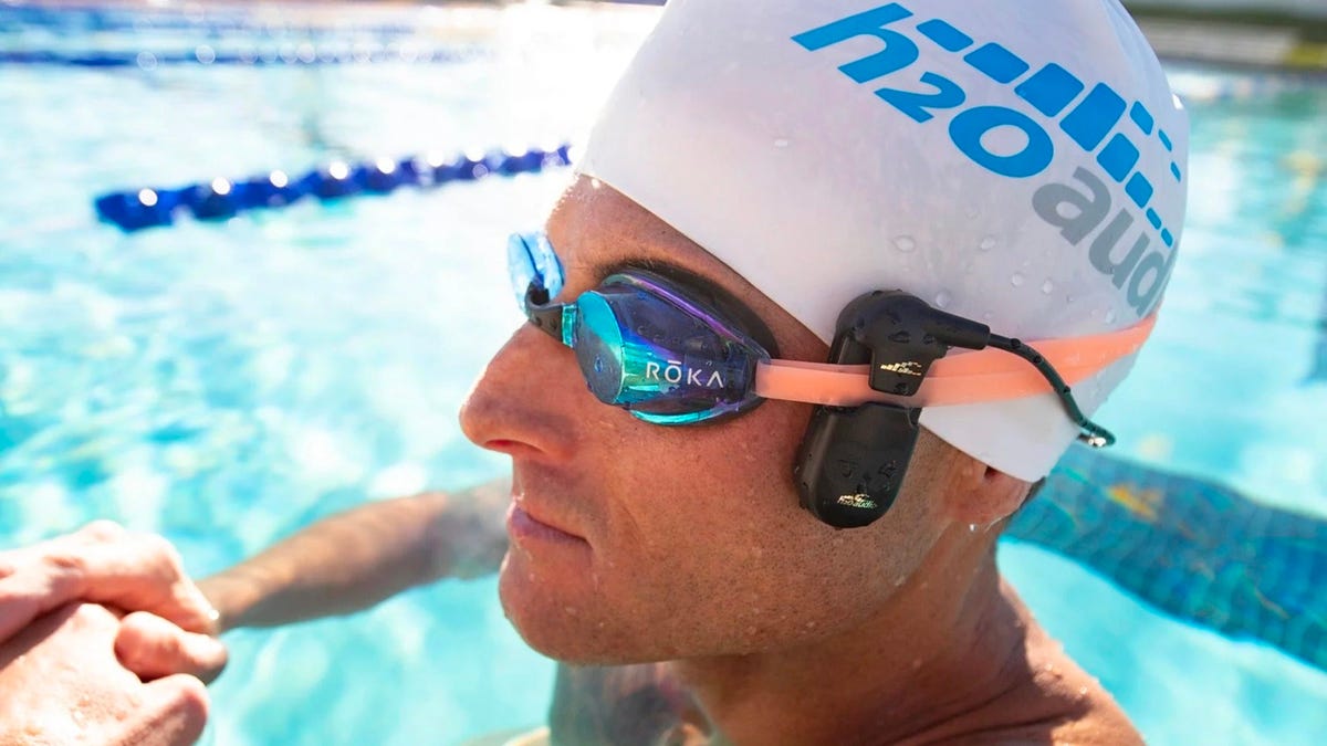 Swimmer wearing H2O Audio Sonar Pro.