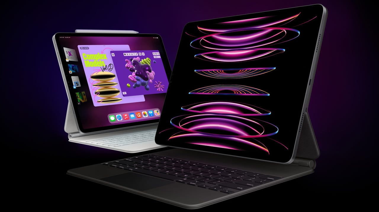Two new iPad Pros on stands, displaying dramatic graphics