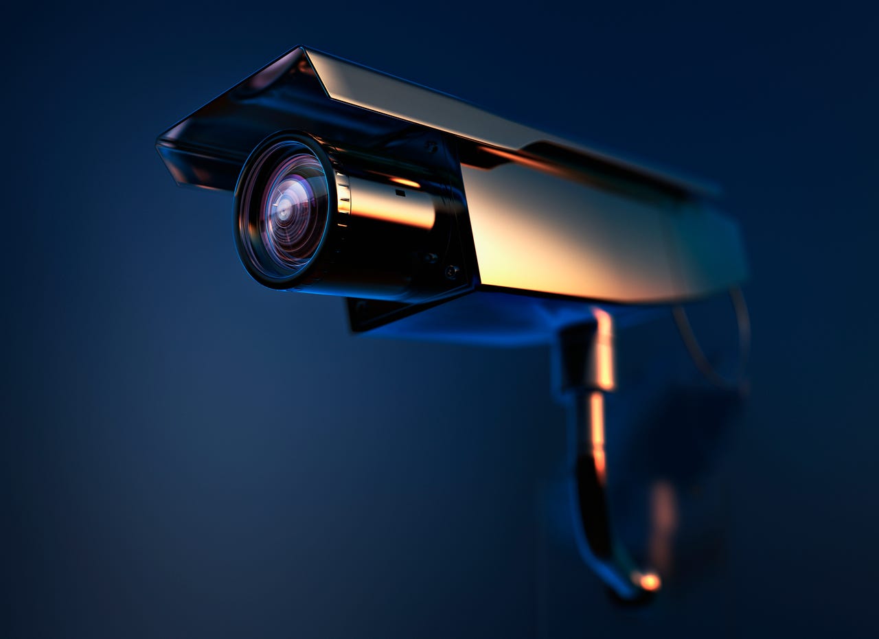 Security camera on blue background