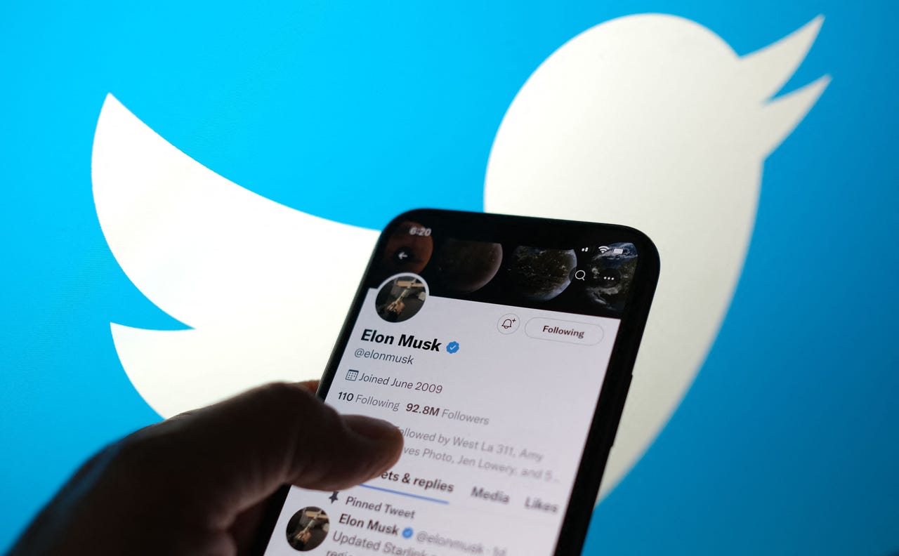 Twitter logo with a phone up front